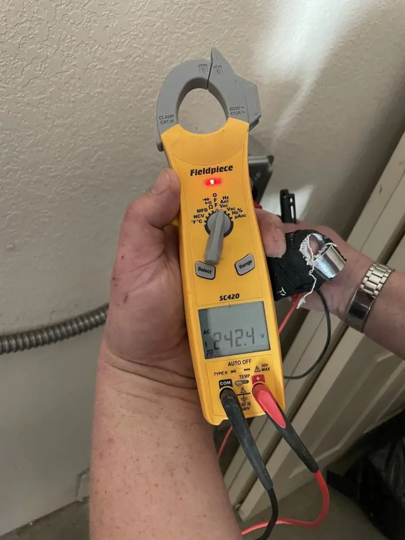 Voltage testing with clamp meter during Generator Installation in Grafton
